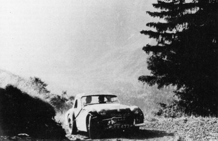 TR3A on rally stage - note dents and lack of road surface